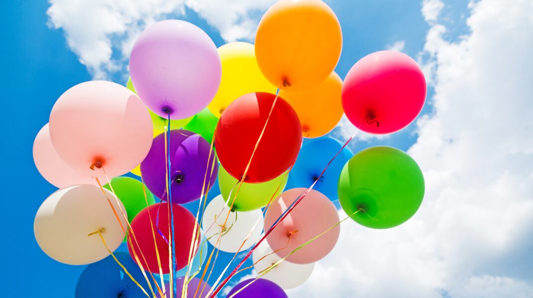 In Celebration 1 Colorful balloons against blue sky